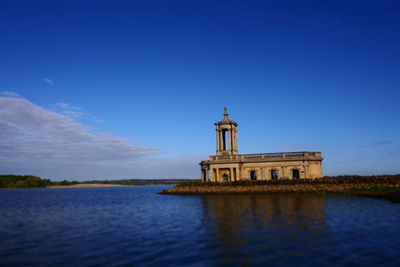 View of lighthouse against blue sky