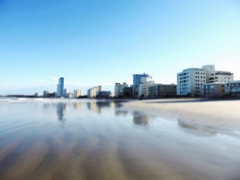 View of cityscape against clear sky