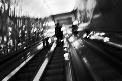 Blurred motion of people walking on road at subway station