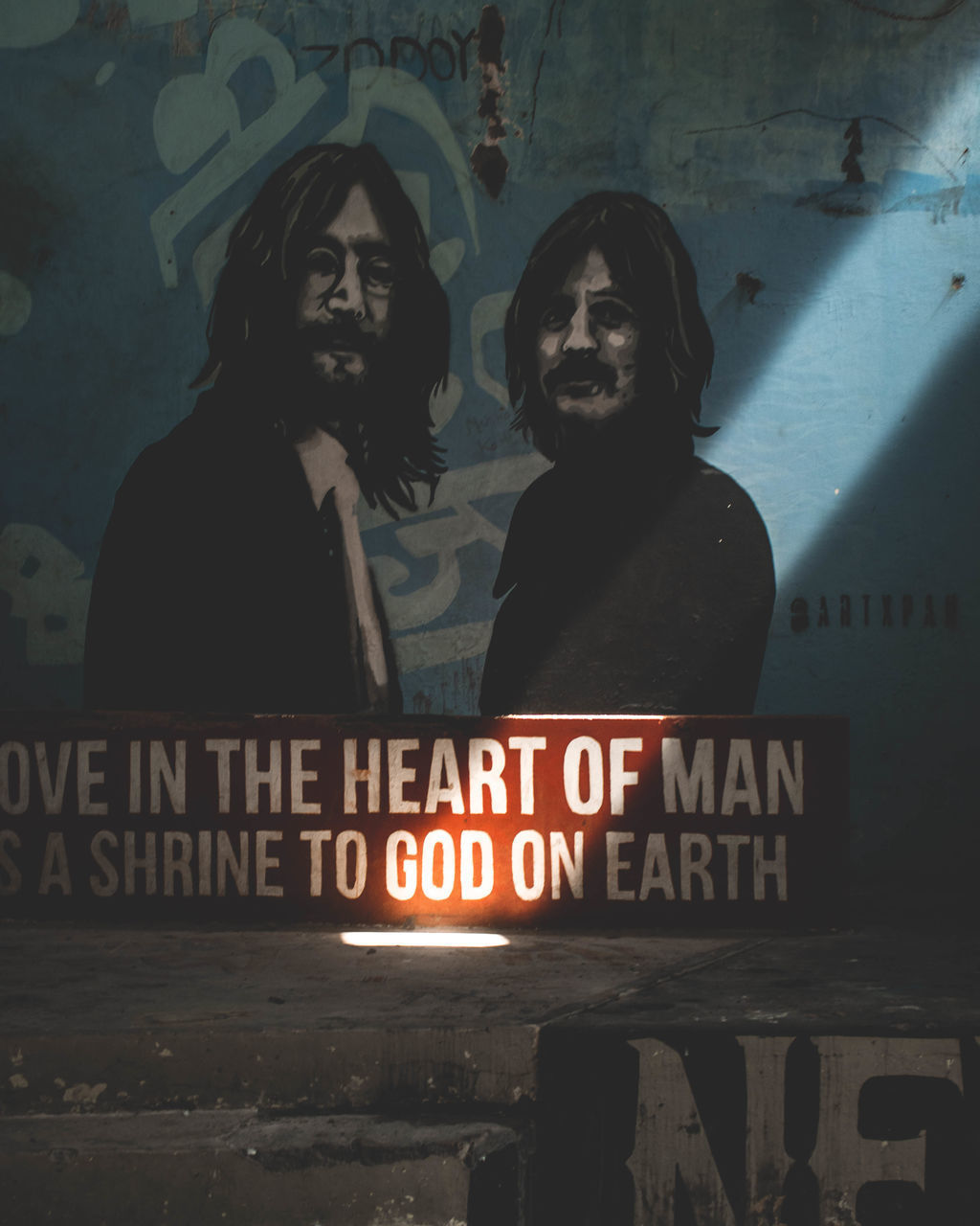 PORTRAIT OF MAN ON WALL