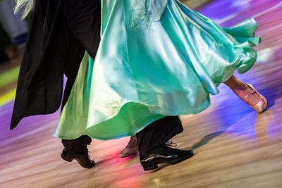 Low section of woman dancing on floor