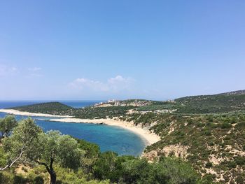 Scenic view of sea against blue sky