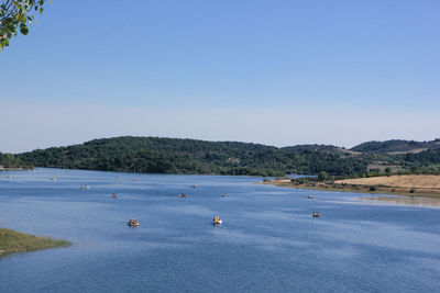 Scenic view of sea against clear blue sky