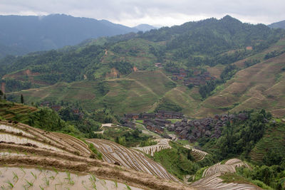 High angle view of agricultural landscape against sky