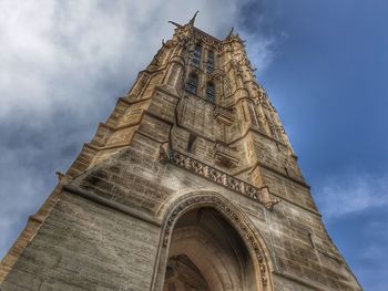 Low angle view of old building against sky