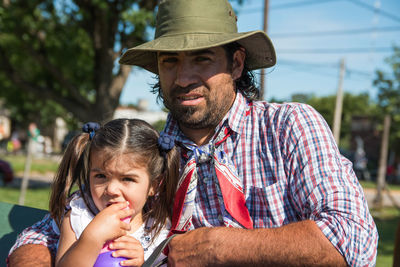 Argentinian father and daughter in traditional festival