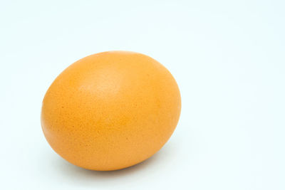 Close-up of orange against white background