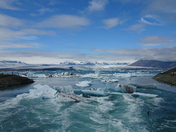 Scenic view of frozen sea against sky