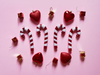 High angle view of candies on table against white background