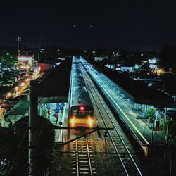High angle view of illuminated railroad station at night