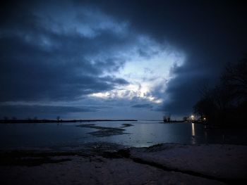 Scenic view of sea against sky at dusk