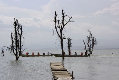 People in boats on sea