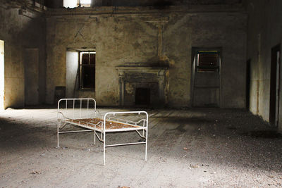 Empty chair in abandoned building