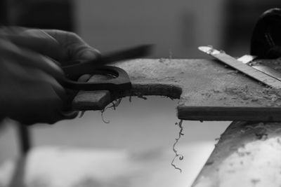 Cropped hands of carpenter working in workshop