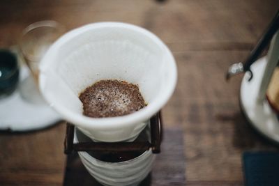 High angle view of coffee cup on table