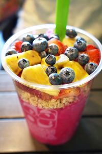 Close-up of smoothie with fruits in bowl on table