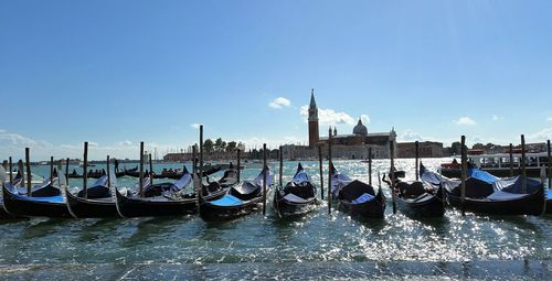 Boats moored at dock