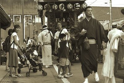 People standing in front of city