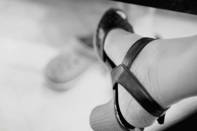 Close-up of person wearing shoes