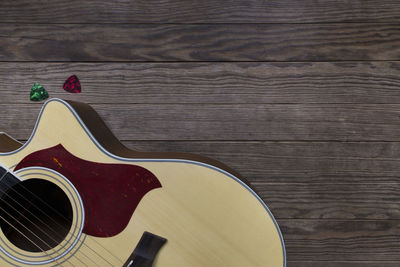 High angle view of guitar on table