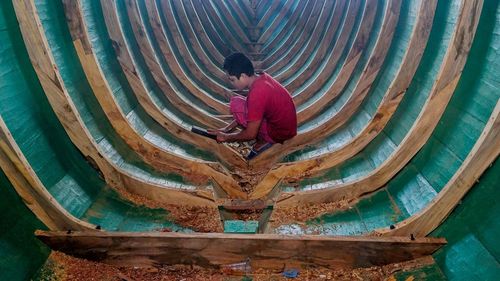 High angle view of man working in water