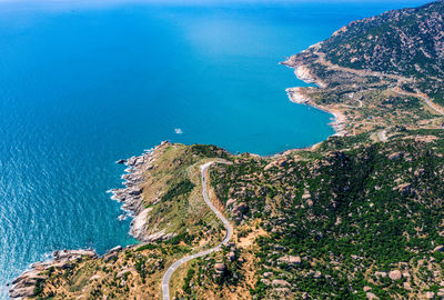 Aerial view sea with land against sky