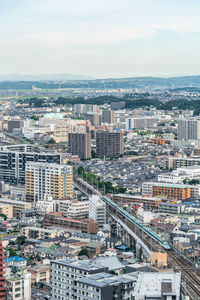 High angle view of buildings in city against sky