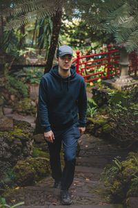 Adventurer walks through the monte palace madeira botanical garden in funchal, of  portuguese island