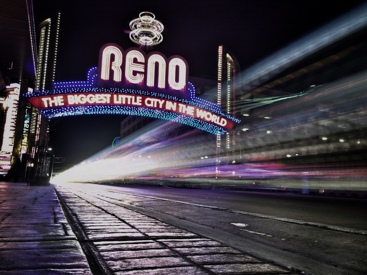 illuminated, night, long exposure, light trail, transportation, speed, blurred motion, motion, built structure, architecture, the way forward, railroad track, city, building exterior, travel, road, travel destinations, city life, outdoors, lighting equipment