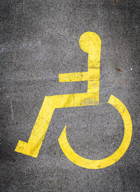 High angle view of disables sign on road