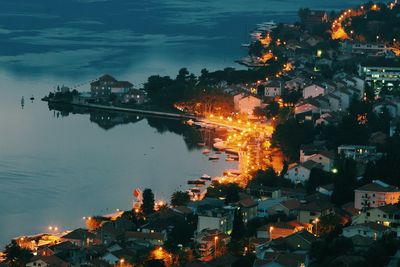 High angle view of illuminated city by kotor bay