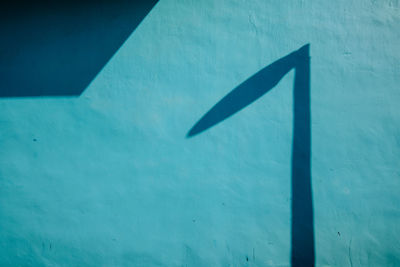 High angle view of arrow sign on wall