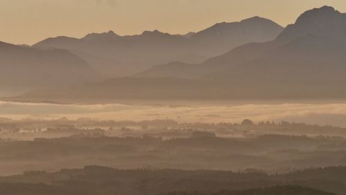 Scenic view of mountains against sky during sunset