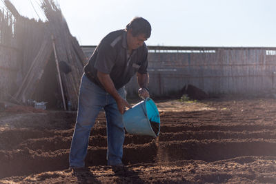 Full length of man working at farm