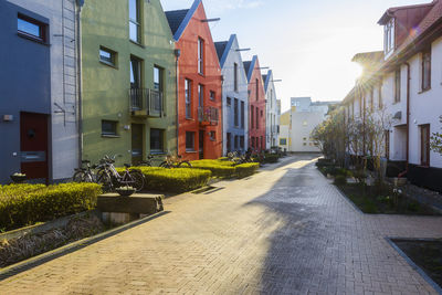 Multi colored buildings along footpath