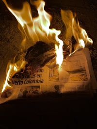 Close-up of fire burning at night