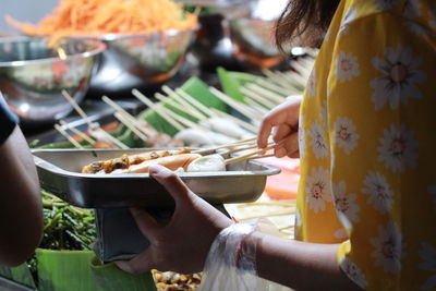 Midsection of woman preparing food