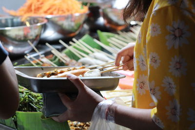 Midsection of woman preparing food