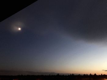 Scenic view of silhouette moon against sky at night