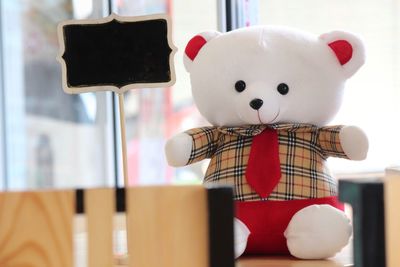 Close-up of teddy bear on table at home