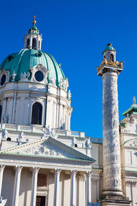 Low angle view of building against clear blue sky