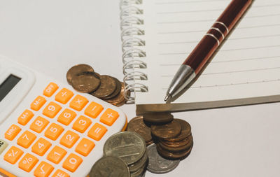 High angle view of coins on table