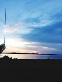 Scenic view of sea against sky at sunset