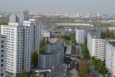 High angle view of buildings in city against sky