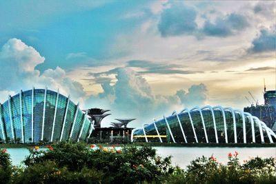 Skyscrapers against cloudy sky