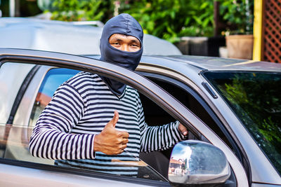 Portrait of man in car