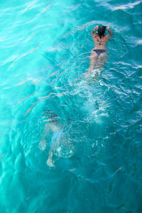 High angle view of man swimming in sea