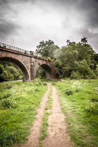 Bridge over landscape against sky