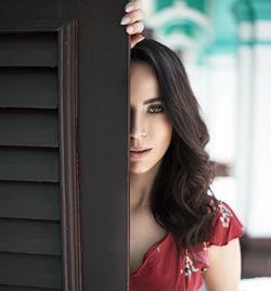 Portrait of beautiful woman standing in corridor