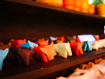 Close-up of multi colored candles on table